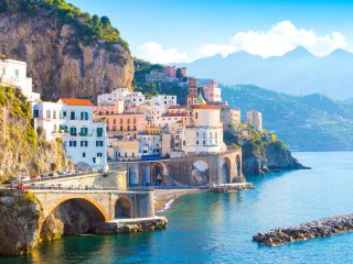 Colorful houses overlooking Mediterranean sea on the Amalfi coast - Accent on Travel